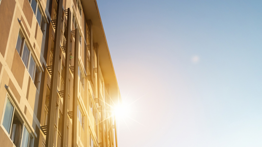 sun shining on a building