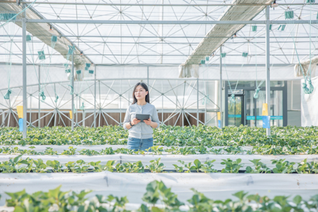 a woman in a greenhouse